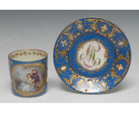 A Sèvres type cabinet cup and saucer, painted with a beau and beauty in a landscape, within a gilt laureate garland, the bleu