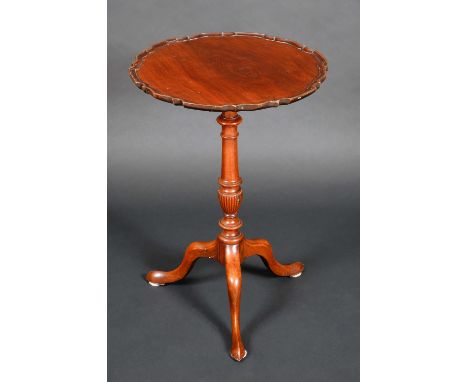 A Chippendale design mahogany shaped circular tripod occasional table, tilting top with pie crust border, turned and fluted p