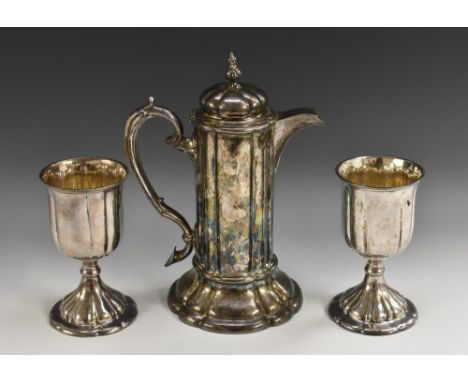 A Victorian Historicist EPNS three-piece quatrefoil communion set, of late 17th century design, comprising a covered flagon a