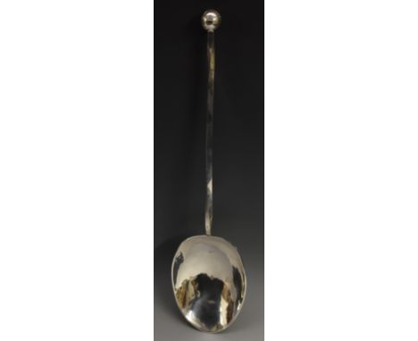 A large Elizabeth II silver Millennium spoon, planished bowl, twisted haft, globe terminal, 38cm long, maker R&amp;R, Birming