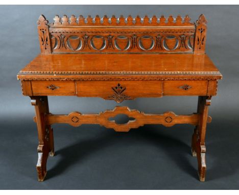 A Reformed Gothic oak console table, shaped gallery, the rectangular top with inlaid dogtooth border, above a frieze drawer, 