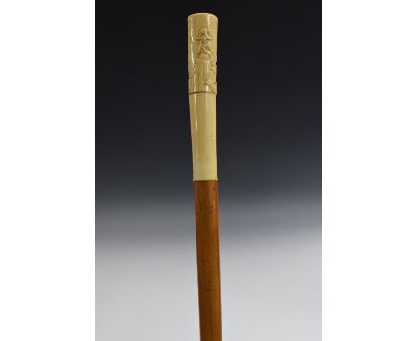 A 19th century Dutch gentleman's bone and malacca novelty walking stick, tapering screw-off pommel carved in high and low rel