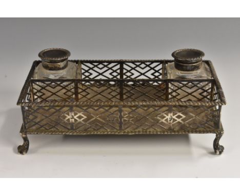 A George III silver rectangular inkstand, gadrooned borders, the sides pierced in the Chinese Chippendale taste with trellis,