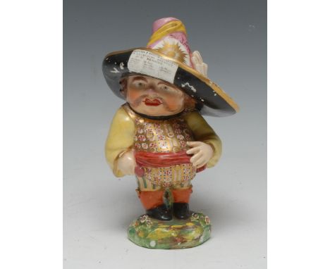 A Derby Mansion House dwarf, standing, wearing a broad brimmed hat, floral fancy shirt, orange sash, shaped circular base, 17