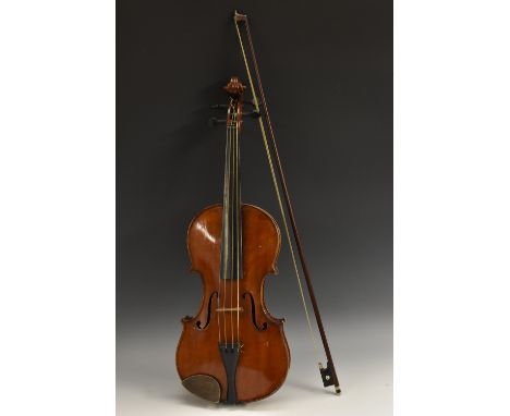 A violin, the two-piece back 35.75cm long excluding button, paper label inscribed T Grater, maker, Antonius Straduarius Modum