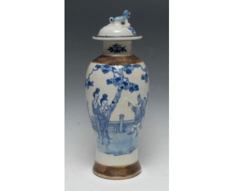 A Chinese slender baluster vase and cover, painted in tones of blue with figures in a pagoda garden, temple lion finial, inci