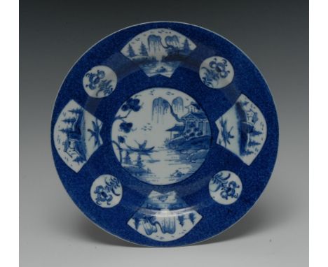 A Bow circular plate, painted with central landscape, the rim with alternating fan and circular shaped panels, 20cm diam, moc