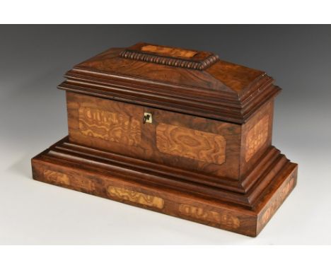 A William IV burr walnut and rosewood sarcophagus tea caddy, the hinged cover with a egg-and-dart frieze, skirted oversailing