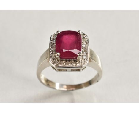A ruby and diamond ring, central pinky red ruby, measuring approx 10.0mm x 7.5mm x 4.64mm, estimated ruby weight approx 3.5ct