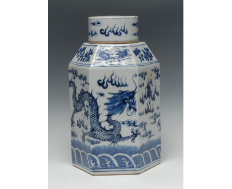 A 19th century Chinese porcelain hexagonal ginger jar and cover, painted in underglaze with a ferocious dragon in pursuit of 