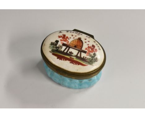A George III South Staffordshire enamel oval patch box, the hinged cover painted with a bee skep and surmounted by the sentim