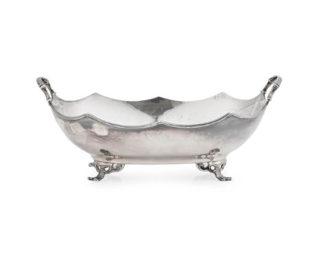 R &amp; W Sorley, Glasgow 1931, of oval form, stylised wave border, the handles of foliate design, all raised four bracket fe