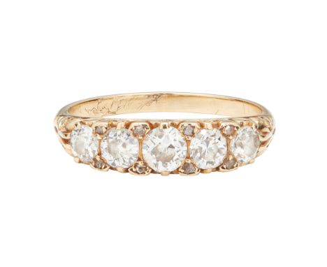 set with five graduated old round-cut diamonds, diamond chip accents, scrolling detail to gallery, plain shank stamped 18ct(R