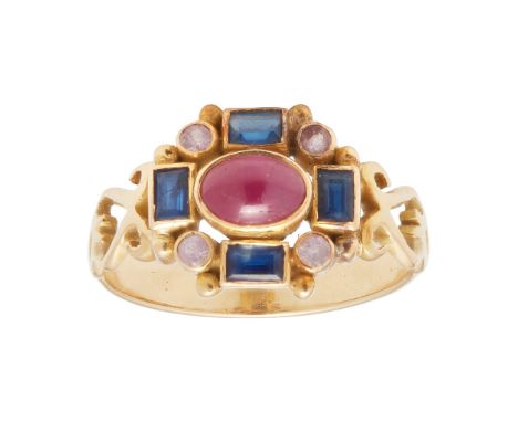 collet set with a ruby cabochon, in a border of baguette-cut sapphires and small round-cut pink sapphires, scrolling detail t