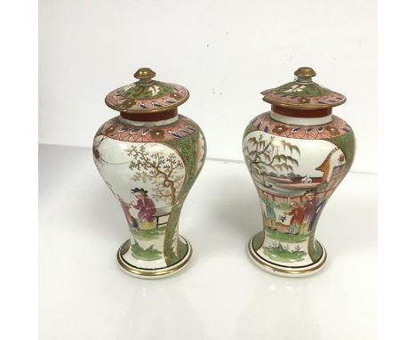 An unusual pair of English heavily potted and enamel painted vases and covers in the Chinese taste, c. 1800, each of baluster