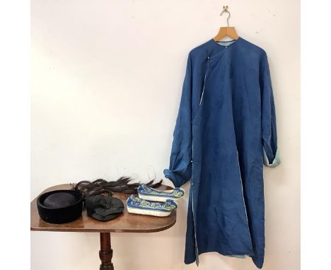 A group of Chinese clothing, early 20th century, comprising: a man's woven blue silk robe, decorated with roundels, with ligh