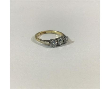 A three-stone diamond ring, the graduated round brilliant-cut stones claw-set on an 18ct yellow gold band, total diamond weig