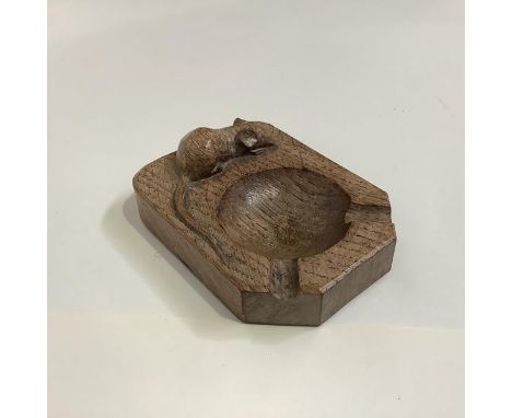 Robert "Mouseman" Thompson of Kilburn, an oak ashtray, c. 1930/40, with carved mouse signature. 10.5cm by 7.5cm. Provenance: 