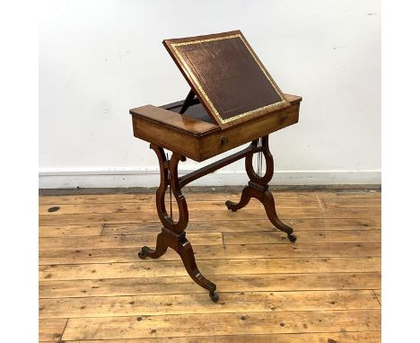 A Regency mahogany writing table, c. 1810, the gilt-tooled leather writing skiver with ratchet mechanism, above a boxwood fri