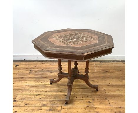 A late 19th century walnut, amboyna and parquetry inlaid centre table, the octagonal top with central chequerboard and radiat