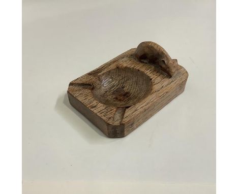 Robert "Mouseman" Thompson of Kilburn, an oak ashtray, c. 1930/40, with carved mouse signature. 10.5cm by 7.5cm Provenance: D