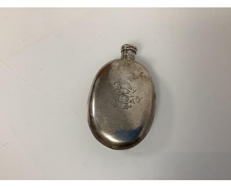 An early Victorian silver scent flask, London 1839, oval, with screw top, engraved with a monogram. 10cm by 6cm, 2.5 troy oun