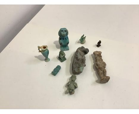 Egyptian antiquities: a pottery turquoise glazed figure of Bes, a turquoise glazed standing figure of Taweret and a single-ha