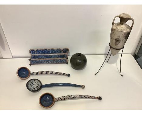 A group of studio ceramics comprising: a glazed stoneware amphora mounted on a wirework stand; a small spherical stoneware va