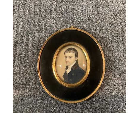 English School, early 19th century, a portrait miniature of a gentleman of sallow complexion, watercolour on ivory, oval, in 