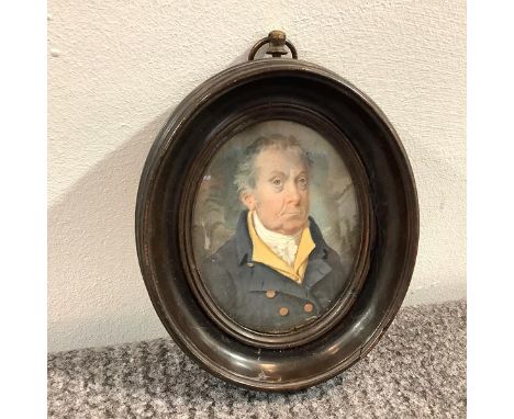 English School, early 19th century, a portrait miniature of an elderly gentleman in yellow waistcoat and brass-buttoned coat,