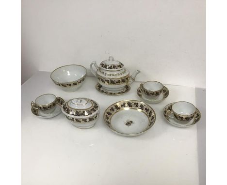A Chamberlains Worcester partial tea service, c. 1800, in the Brown Grape Vines pattern, comprising teapot, sucrier on stand,