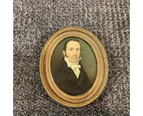 English School, c. 1820, a portrait miniature of a gentleman in high white collar and stock, watercolour on ivory, oval, in a