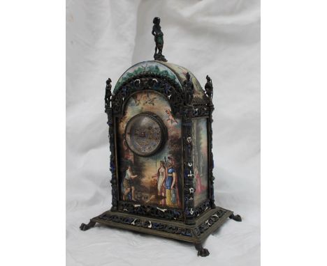 A 19th century French enamel and white metal mounted mantle clock, the domed top decorated with figures in a landscape with a