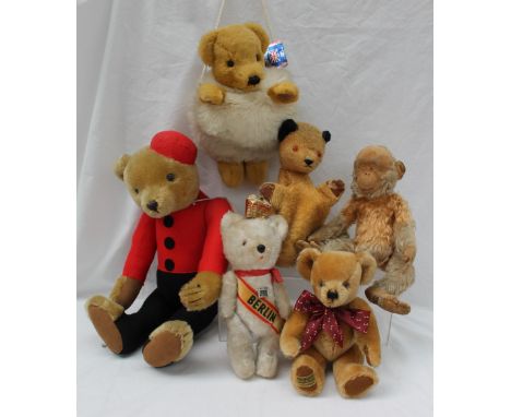 A Merrythought teddy bear, together with a Merrythought monkey, Merrythought purse, Sooty puppet, Fred Bruin teddy and a Berl