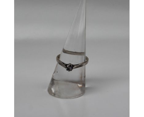A solitaire diamond ring, the round brilliant cut diamond approximately 0.2ct, to an 18ct white gold setting and shank approx