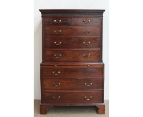 A George III mahogany chest on chest, the moulded dentil cornice above a blind fretwork frieze, two short drawers, six long g