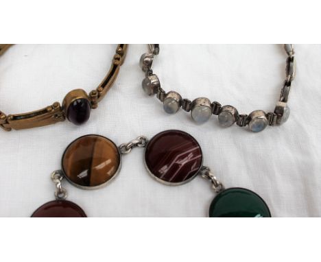 A white metal bracelet set with oval Moonstones, together with a yellow metal expanding bracelet set with an amethyst and ban