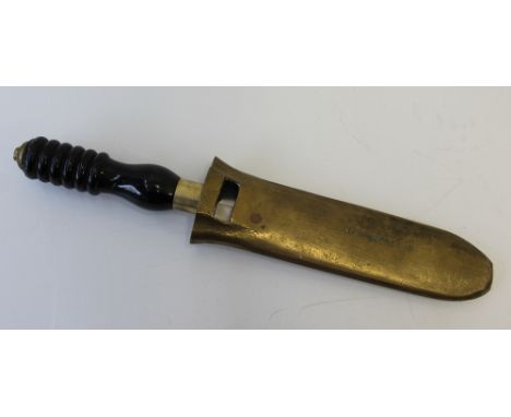 A diver's knife, the double sided and serrated edge 20cm blade inscribed 0433-431-7338 Non Magnetic, to a brass cross section