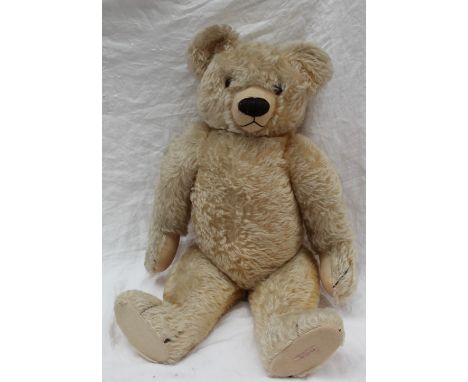 A large Chad Valley mohair teddy bear, with movable limbs and a stitched nose, 61.5cm tall CONDITION REPORT: the colour has b