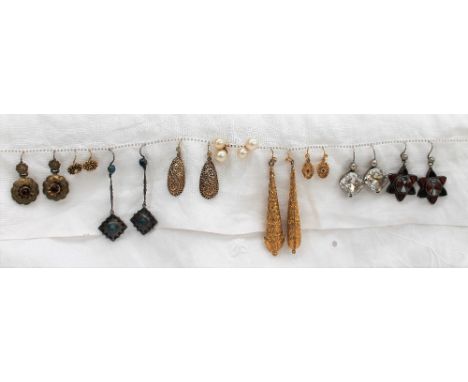 A pair of pearl earrings together with eight other pairs of earrings