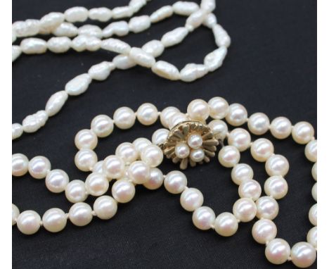 A pearl necklace with fifty-eight regular pearls each approximately 7mm diameter to a 9ct yellow gold pearl set clasp togethe