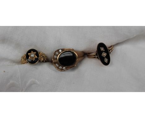 A 9ct yellow gold onyx and paste set dress ring together with two other onyx set rings