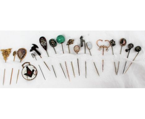 A malacite ball stick pin together with opal set stick pins, paste set stick pins and other assorted stick pins