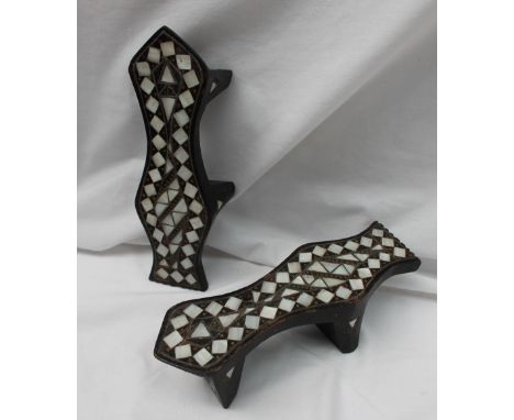 A pair of hardwood shaped mother of pearl inlaid Geisha shoes, inlaid in a geometric pattern, 23.5cm long x 6.5cm high 