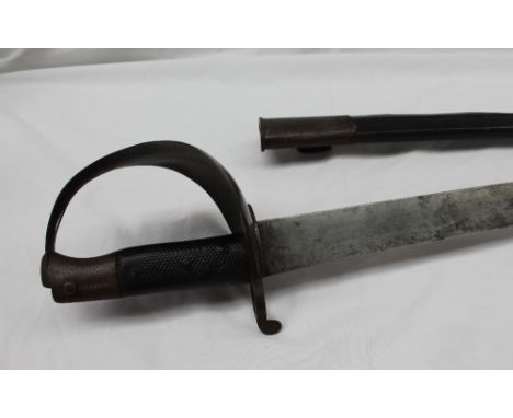 A 19th century sword bayonet, with a steel guard and textured grip, in a leather and steel scabbard, 85cm long CONDITION REPO