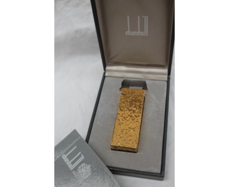 A Dunhill gold plated lighter with a bark texture, cased