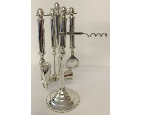 A modern silver plated bar/cocktail tools set with display stand. Total height approx. 27cm tall.