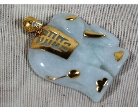 A 14ct gold jade pendant in the form of an elephant