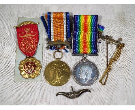 A World War One (WWI) medal group, inscribed to the rims, 200200 GNR W HOWARTH R A and a Royal Order of Buffaloes gilt medall