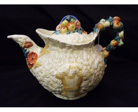 A Clarice Cliff lidded teapot decorated in Celtic Harvest pattern 15.5cm (h) - Est £70 -100